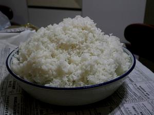 Quantas calorias em 1 Oz Arroz Branco (Curto, Cozido)?