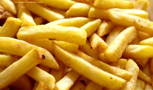 Quantas calorias em 1 Oz Batatas Fritas (Inalterado, com Sal, Congelado)?