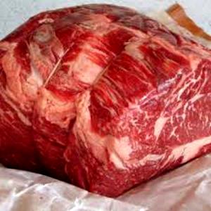 Quantas calorias em 1 Oz Carne de Vaca da Capa de Filé (Cortada até 0,5 cm de Gordura)?