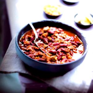 Quantas calorias em 1 Oz Chili com Carne com Feijões?