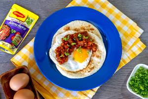 Quantas calorias em 1 Oz Huevos Rancheros?