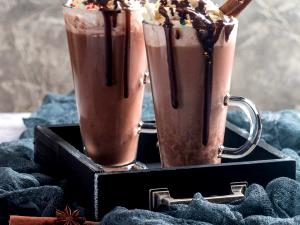 Quantas calorias em 1 Oz Milk Shake de Chocolate?