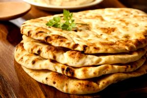 Quantas calorias em 1 Oz Naan Indiano?