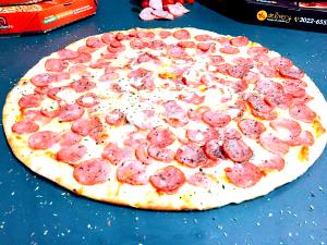 Quantas calorias em 1 Oz Pizza de Calabresa?