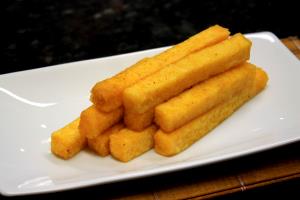 Quantas calorias em 1 Oz Polenta Frita?