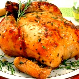 Quantas calorias em 1 Oz, Sem Ossos Sobrecoxa de Frango no Forno, Grelhada ou Assada (Pele Consumida)?