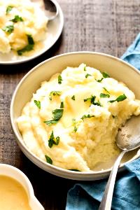 Quantas calorias em 1 porção Garlic Mashed Potatoes?