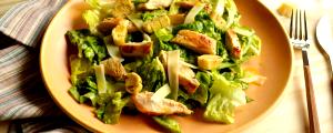 Quantas calorias em 1 porção Salada Caesar Grill?