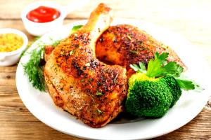 Quantas calorias em 1 Porção Carne frango sobrecoxa com pele assada sem sal?