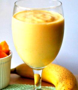 Quantas calorias em 1 Porção Laranja e banana suco natural com açúcar refinado?