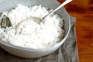 Quantas calorias em 1 Porçoes Arroz Branco Refogado?