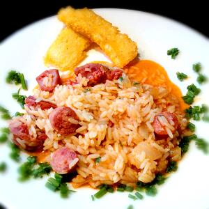 Quantas calorias em 1 Porçoes Arroz Com Linguiça De Pernil?