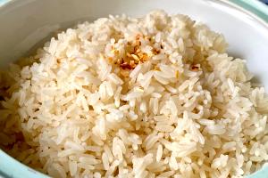 Quantas calorias em 1 Porçoes ARROZ PARBORIZADO - COZIDO?