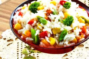 Quantas calorias em 1 Porçoes Arroz Primavera?