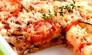 Quantas calorias em 1 Porçoes Arroz À Parmegiana?