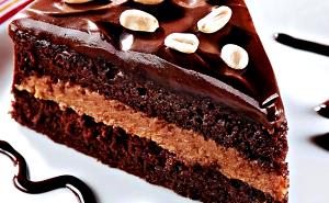 Quantas calorias em 1 Porçoes Bolo De Amendoim E Chocolate?