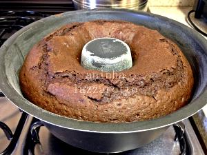 Quantas calorias em 1 Porçoes Bolo De Chocolate E Castanhas Da Aninha?