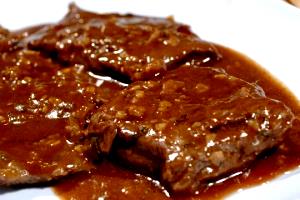 Quantas calorias em 1 Porçoes Carne Bovina Bife Cozido?