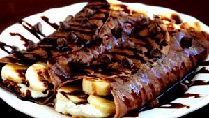 Quantas calorias em 1 Porçoes Crepe De Chocolate Com Massa De Banana?