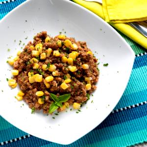 Quantas calorias em 1 Porçoes Guisadinho Com Milho?