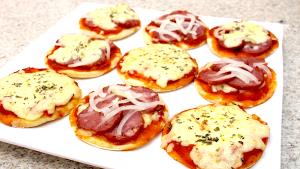 Quantas calorias em 1 Porçoes Mini Pizza?