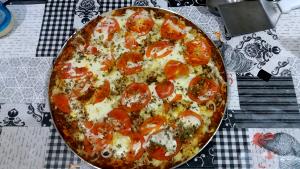 Quantas calorias em 1 Porçoes Pizza Carne Moida?