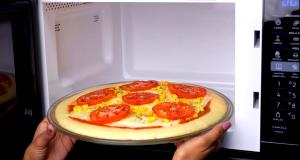 Quantas calorias em 1 Porçoes Pizza De Microondas?