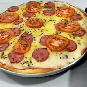 Quantas calorias em 1 Porçoes Pizza İntegral Caseira?