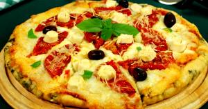 Quantas calorias em 1 Porçoes Pizza Vegetariana?