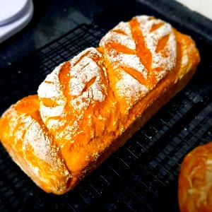 Quantas calorias em 1 Porçoes Pão Artesanal?