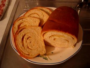 Quantas calorias em 1 Porçoes Pão Caseiro Com Parmesão?