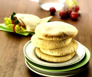 Quantas calorias em 1 Porçoes Pão DK?