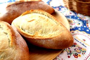 Quantas calorias em 1 Porçoes Pão Português?
