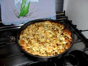 Quantas calorias em 1 Porçoes Torta De Bacalhau De Festa?