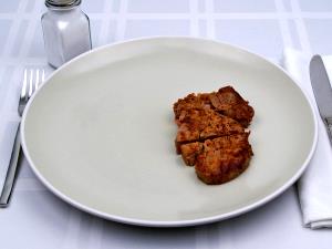 Quantas calorias em 1 Porção (85,0 G) Filé Porterhouse, cozido?