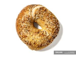 Quantas calorias em 100 G Bagels (inclui Cebola, Papoila, Sésamo)?