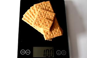 Quantas calorias em 100 G Crackers Graham?