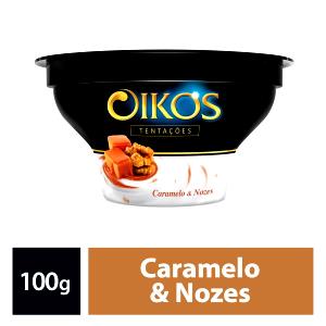 Quantas calorias em 100 g Oikos Tentações Caramelo e Nozes?